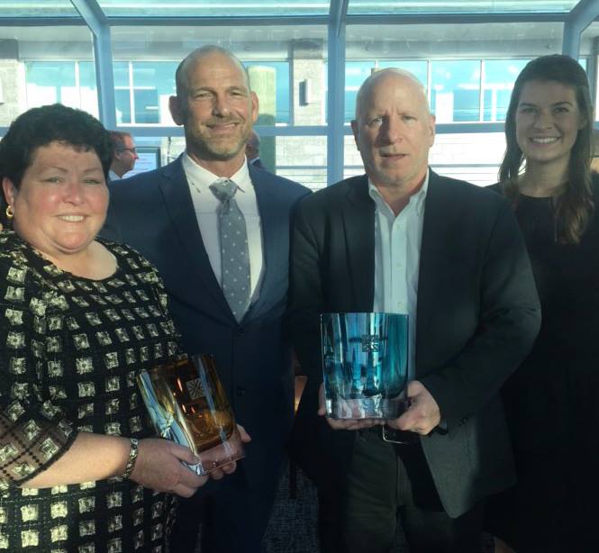 Derse's, Russ Fowler, with award and colleagues