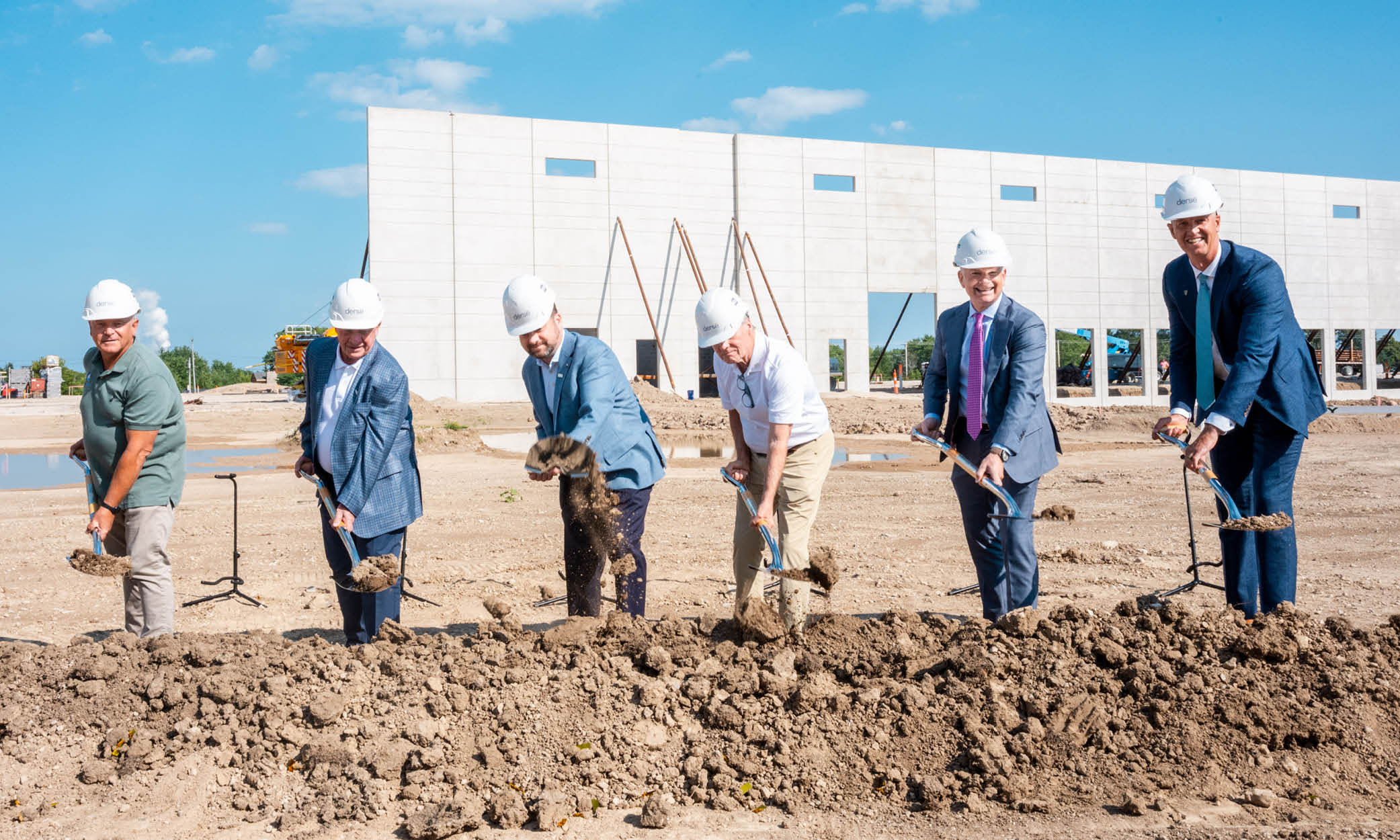 Derse owners, CEO, Oak Creek mayor, and partners with ceremonial shovels at the new Derse headquarters groundbreaking.