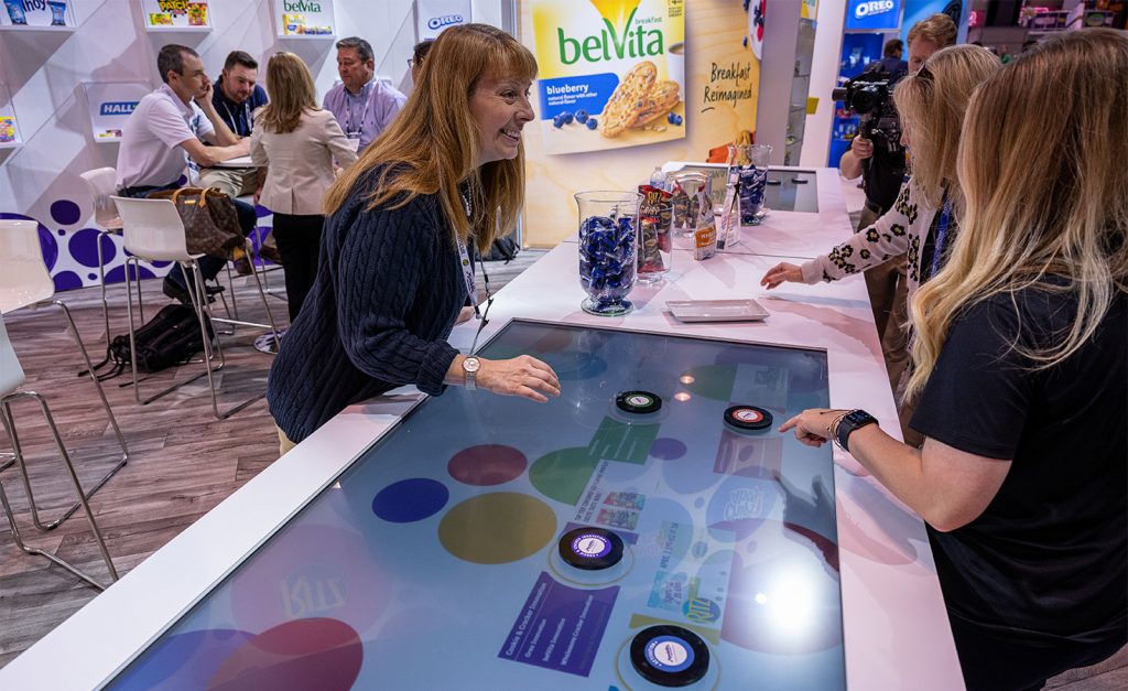 Mondelez Trade Show Booth woman engaging with attendees