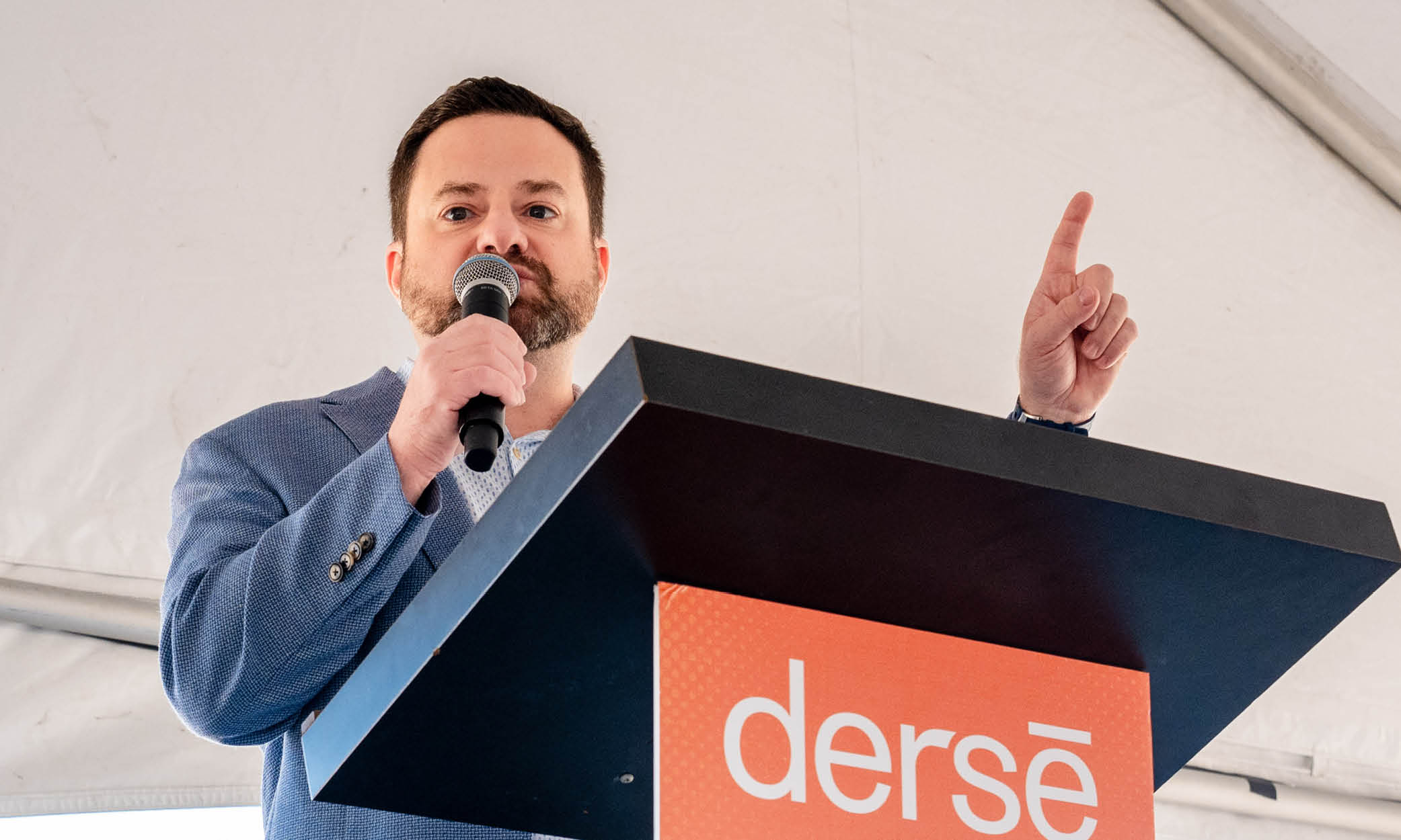 Brett Haney, CEO of Derse, speaks onstage at Derse’s new headquarters groundbreaking in Oak Creek, Wisconsin.