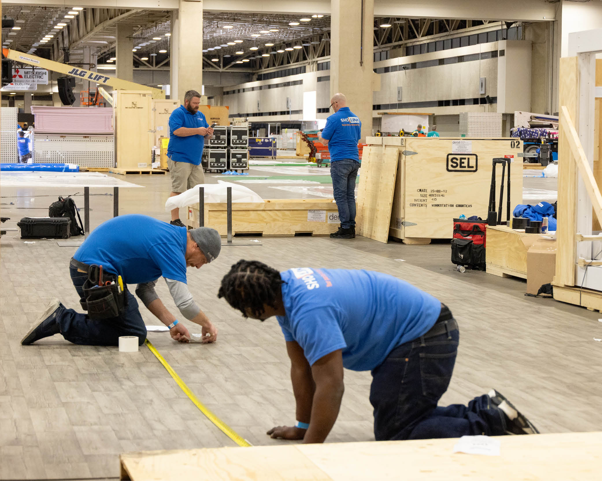 Show floor services supporting a manufacturing trade show exhibit.