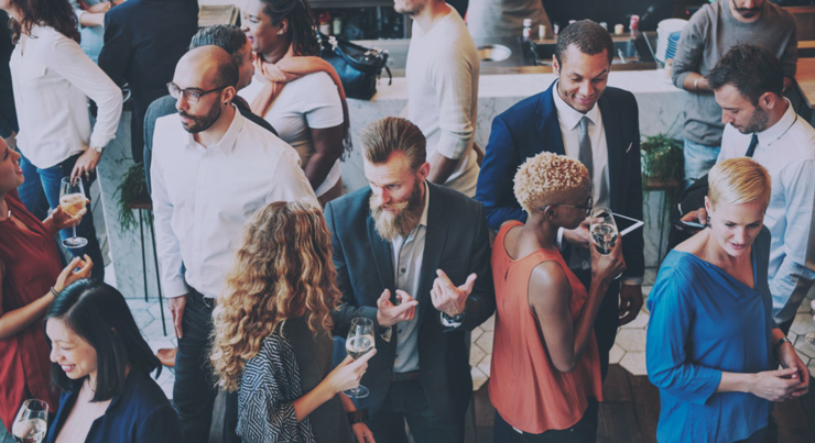 group of adults mingling at a networking event