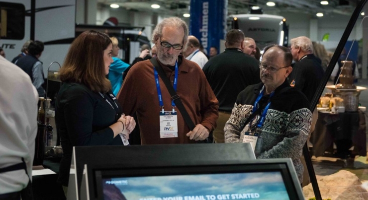 attendees engaging within exhibit space